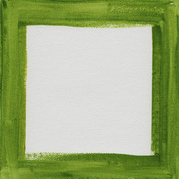 Зеленая рамка на белом холсте — стоковое фото