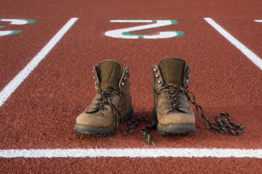 Wrong shoes on running tracks clipart