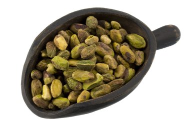 Scoop of raw shelled pistachio nuts clipart