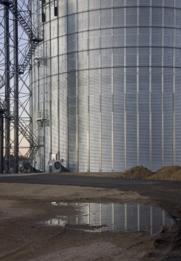 Newly constructed metal grain silo clipart