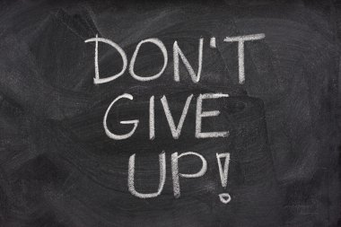 Dont give up phrase on blackboard clipart