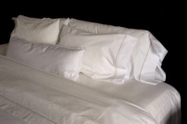 Pillows on a hotel bed clipart
