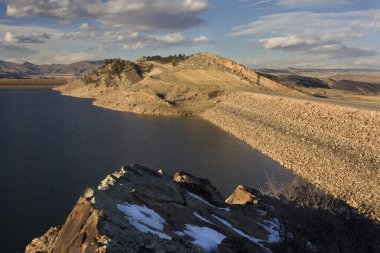 Dams of mountain reservoir in Colorado clipart
