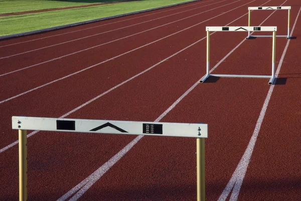 Running tracks with three hurdles — Stock Photo, Image