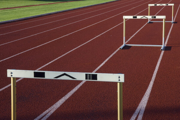 Running tracks with three hurdles