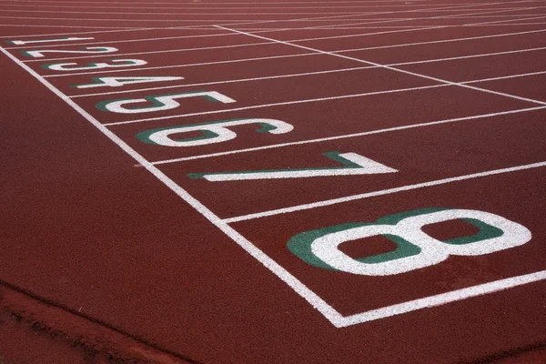 Running tracks with starting numbers — Stock Photo, Image