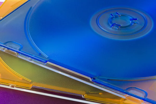 CD or DVD disks in colorful jewel cases — Stock Photo, Image
