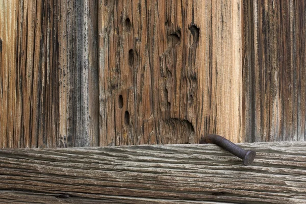 Weathered wood and a big, rusty nail — Stock Photo, Image