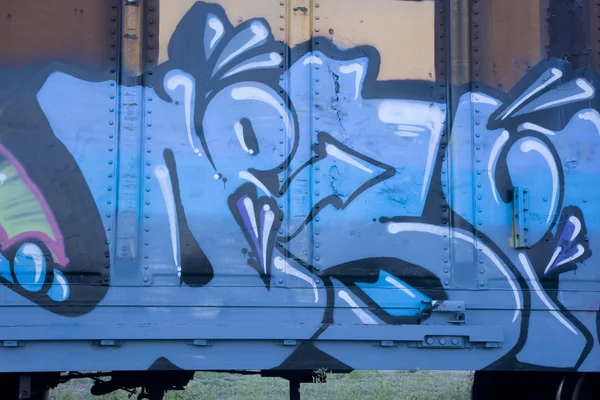 Blue graffiti on a train
