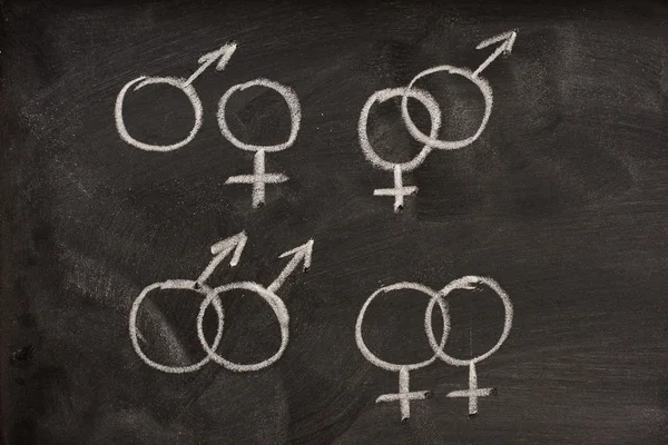 Paren van mannelijke en vrouwelijke geslacht symbolen op een b — Stockfoto