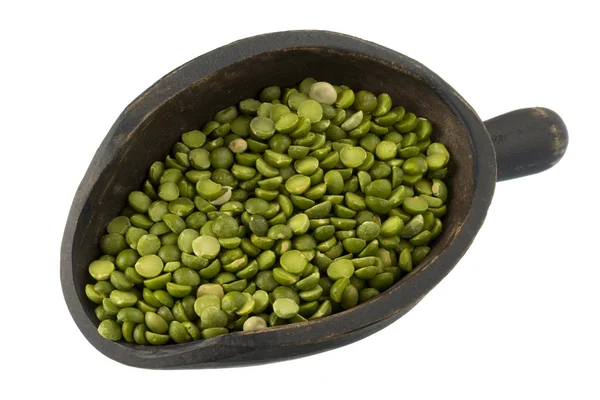 Scoop of green split peas — Stock Photo, Image