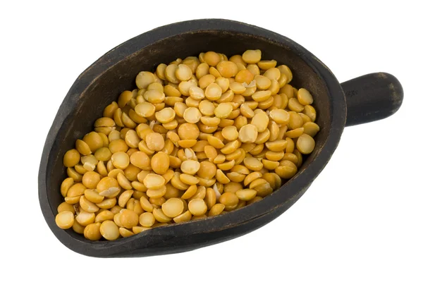 Scoop of yellow split peas — Stock Photo, Image