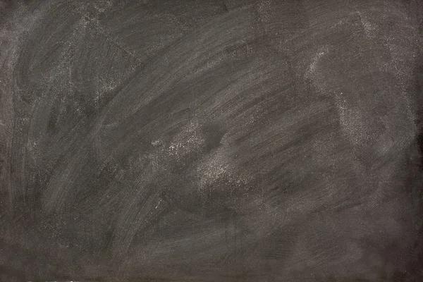 Witte kalk vlekken op een schoolbord — Stockfoto