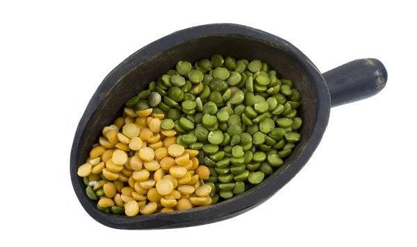 Scoop of green and yellow pea — Stock Photo, Image