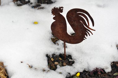 Metal cock in snow clipart