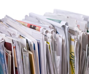 Vertical pile of newspapers and flyers clipart