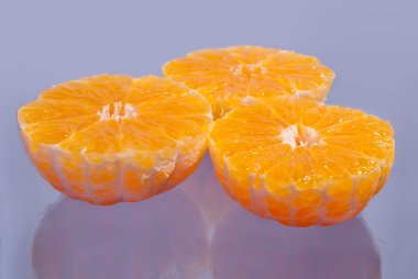 Bunch of mandarins on lilac clipart