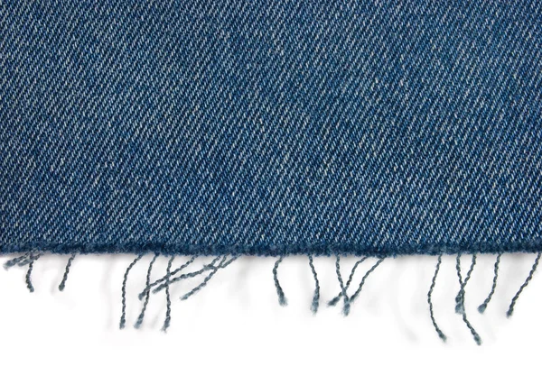 stock image Edge of blue jeans fabric with fringe