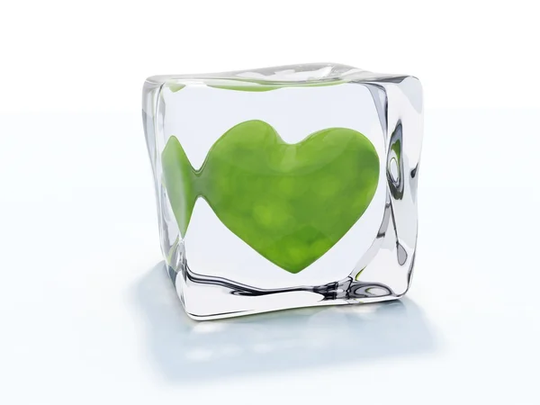 Green heart frozen in ice cube — Stock Photo, Image