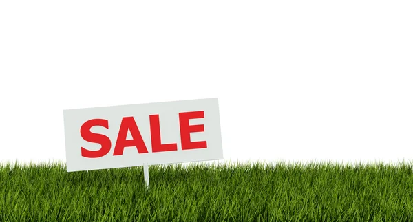 Sale tag on green grass — Stock Photo, Image
