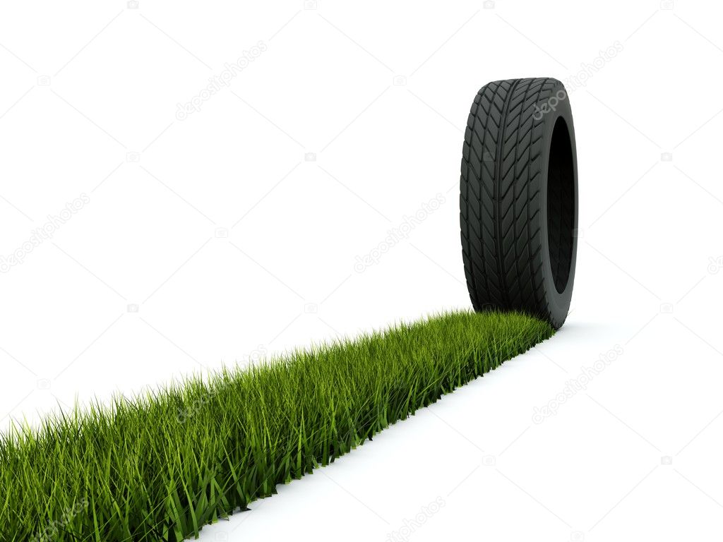 Tire with track from grass isolated on w