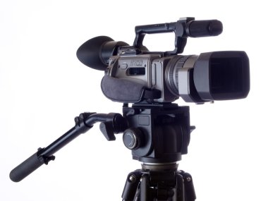 Black Video camera mounted on tripod clipart