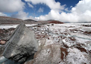 Stone on the glacier moraine in Caucasus clipart