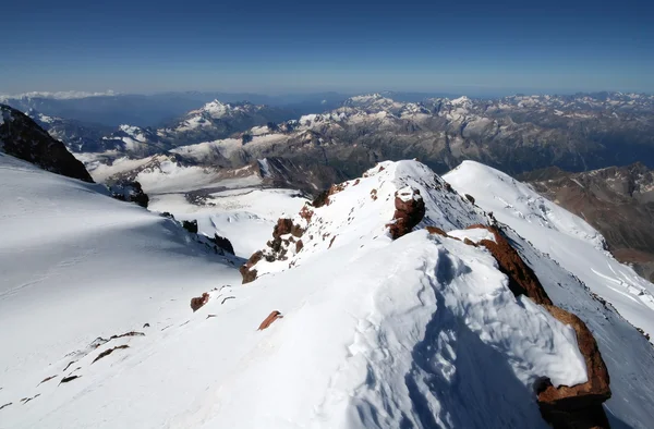Snow rocks in mountains from peak Elbrus — Stock Photo, Image