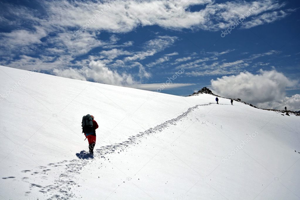 Climbers at the snow slope in Caucasus