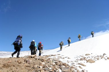 Alpinists at the climbing in Caucasus mountains clipart