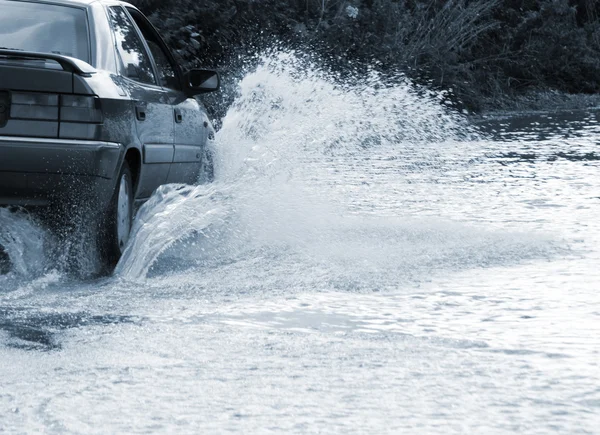 stock image Car driving in water