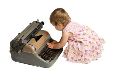 Baby Girl Typing on a Typewriter clipart