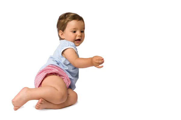 Baby flicka försöker röra något — Stockfoto