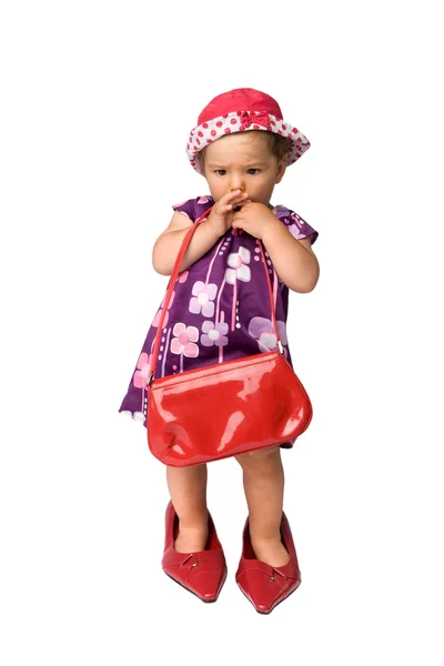 Meisje van de baby en grote schoenen — Stockfoto