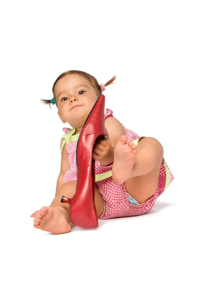Meisje van de baby probeer op schoen — Stockfoto