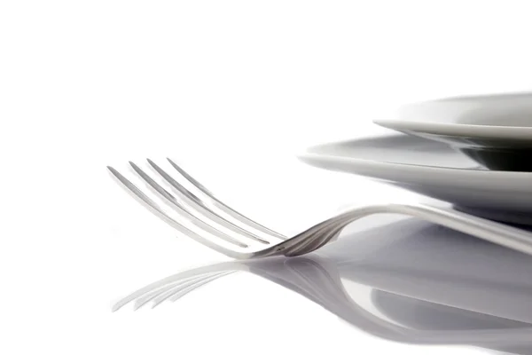 Forchetta e coltello su un piatto — Foto Stock