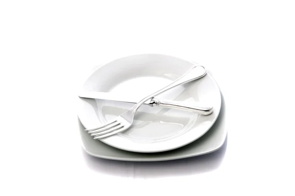Vidlička a nůž na talíři — Stock fotografie