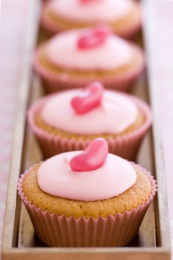 Row of pink cupcakes clipart
