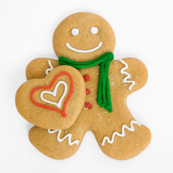 Gingerbread man with gingerbread heart — Stock Photo, Image