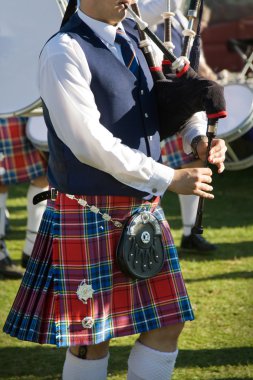 Scottish bagpiper at Pitlochry Highland Games clipart