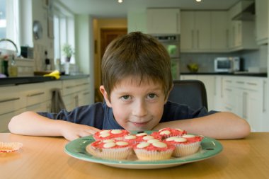 Boy with cupcakes clipart