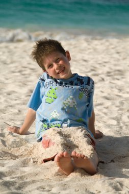 Boy on a beach clipart