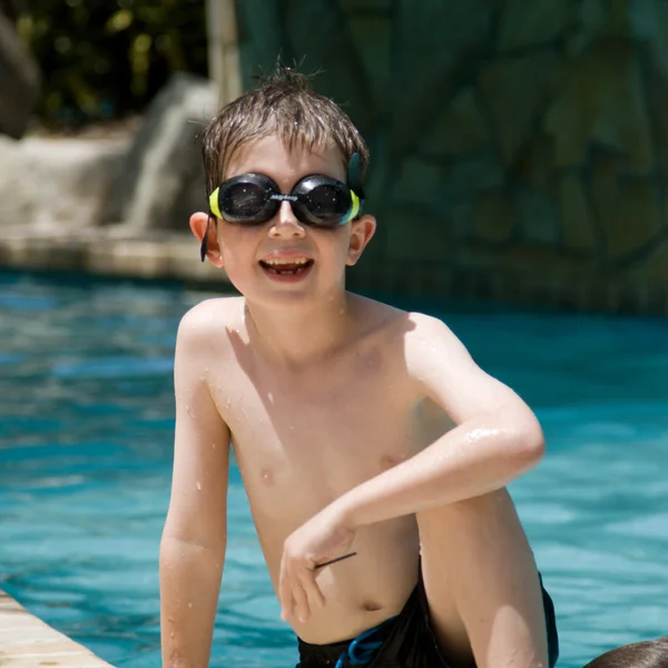Boy at a swimming pool — Stock Photo, Image