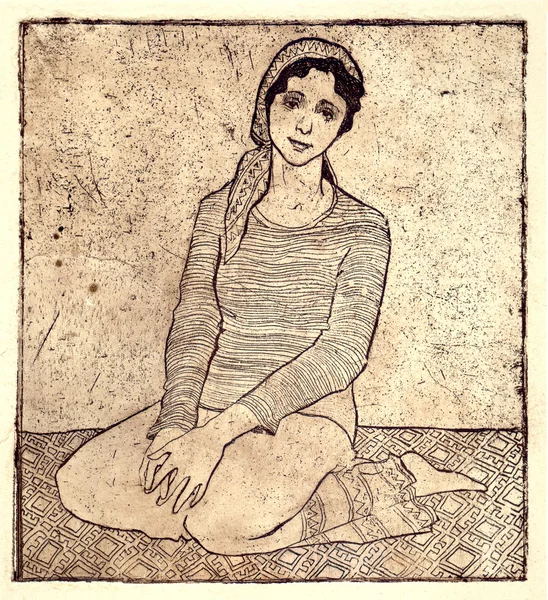 Het meisje zitten op een tapijt — Stockfoto