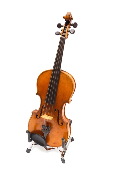 Geige auf einem Sockel. iisoliert lizenzfreie Stockfotos