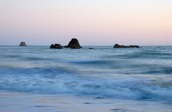 Wellen bei Sonnenuntergang — Stockfoto
