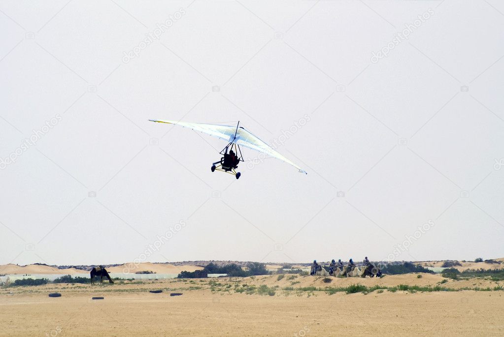 Motorized hang glider in Sahara