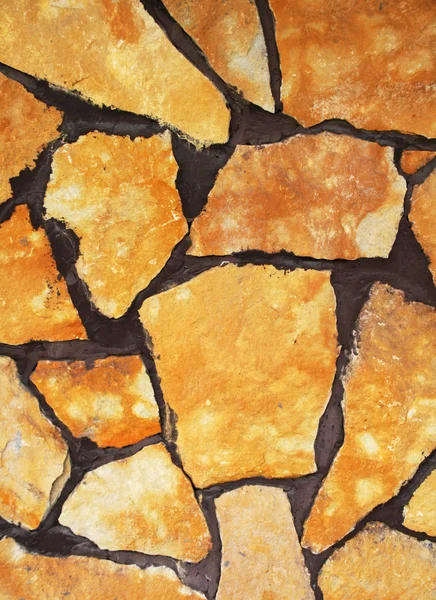 Parede amarela pedra — Fotografia de Stock