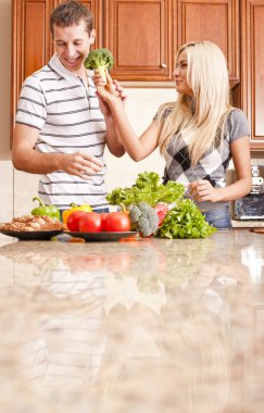 Young Couple in Kitchen clipart