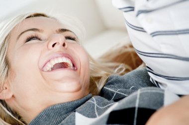 Laughing Woman By Man's Chest clipart